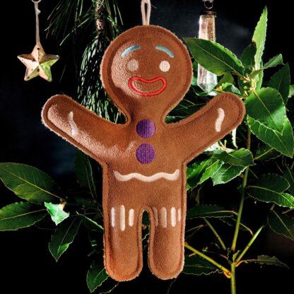 0703625146060 Jean Genie the Gingerbread Person Eco Dog Toy hanging on a Christmas tree with its built-in hanger